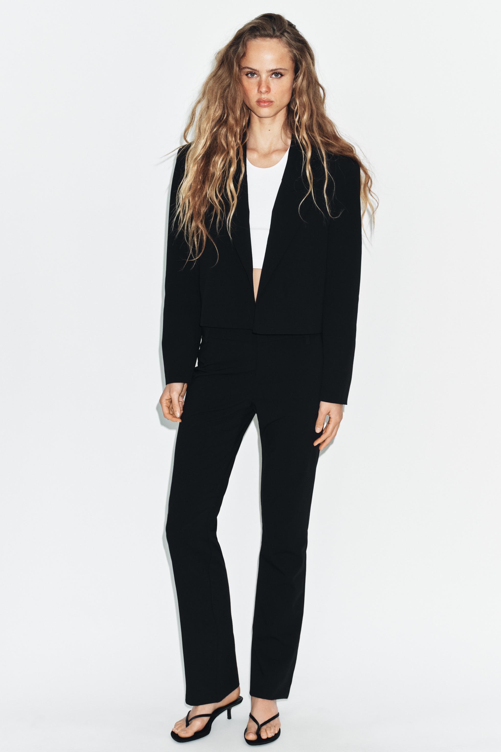 PANTALON FLARE À PASSANTS
